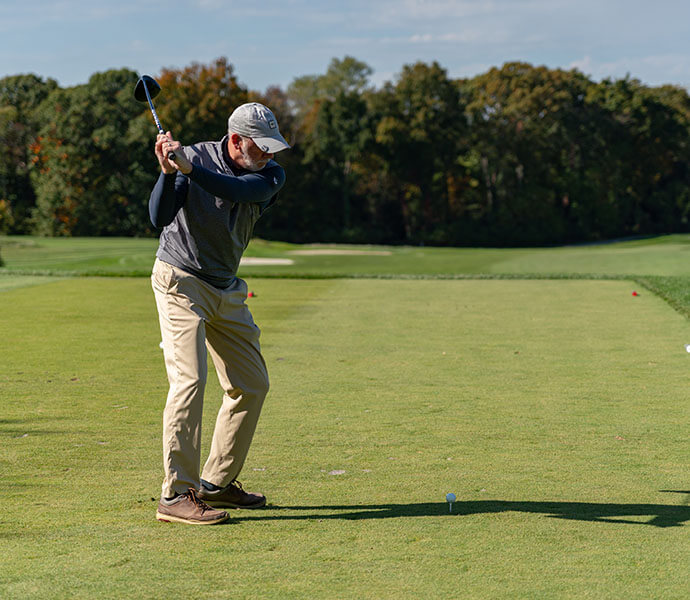 person golfing